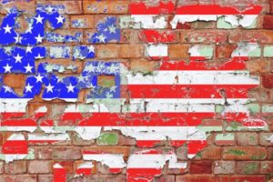 chipped flag on brick wall