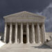 Dark forbidding storm sky over the United States Supreme Court building in Washington DC.